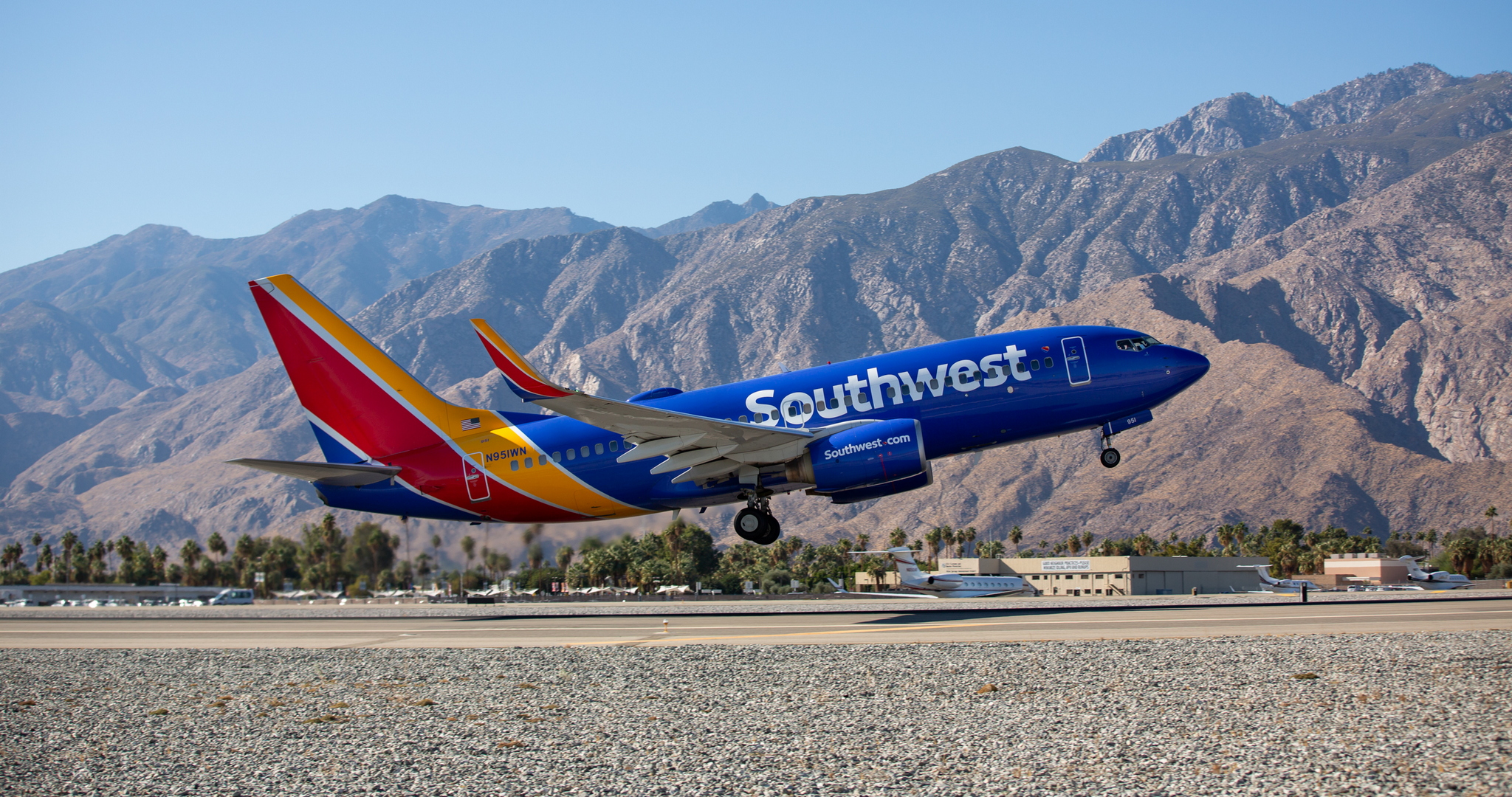 Southwest Airlines 737-700 taking off with mountains in back