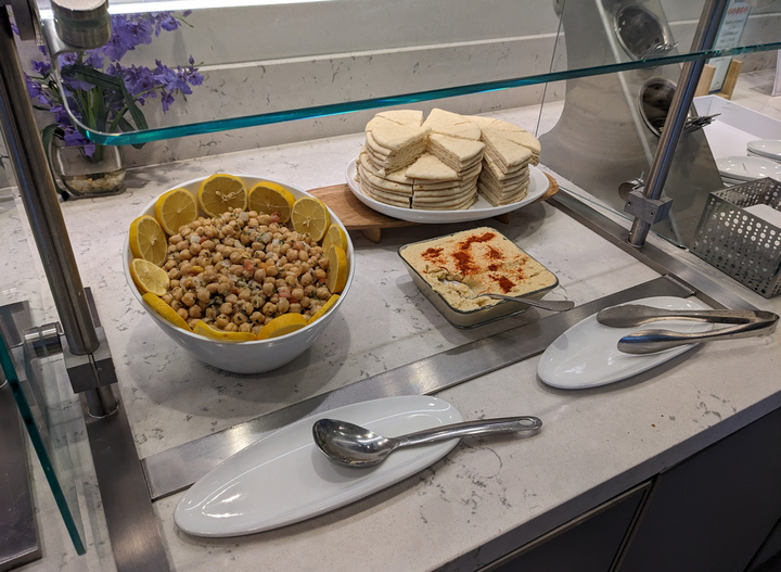hummus, pita and chickpea items on buffet