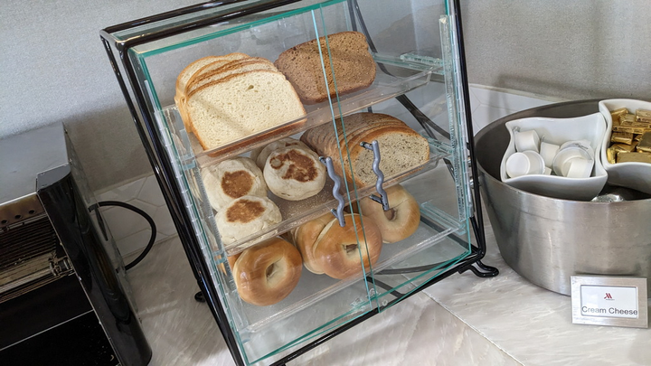 sealed container with bread and bagels.