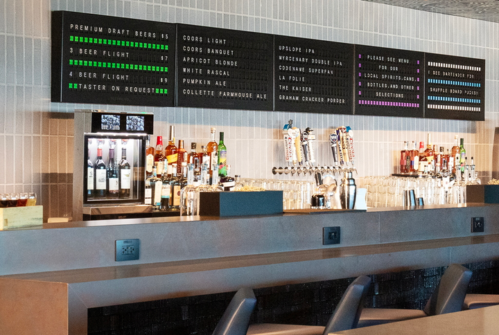 Bar area with beer board and pricing.