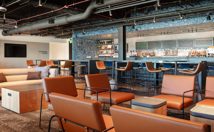 bar feature and seating in United Club, Denver.