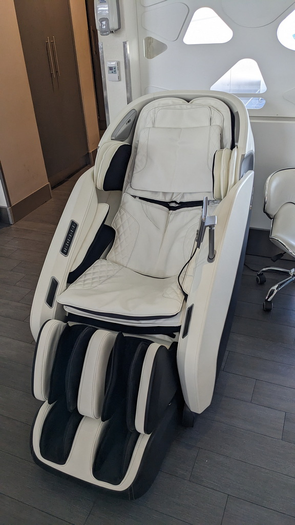 deluxe white leather massage lounger chair.