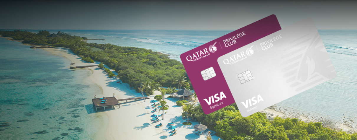 two Qatar airways credit cards, with a beach background.