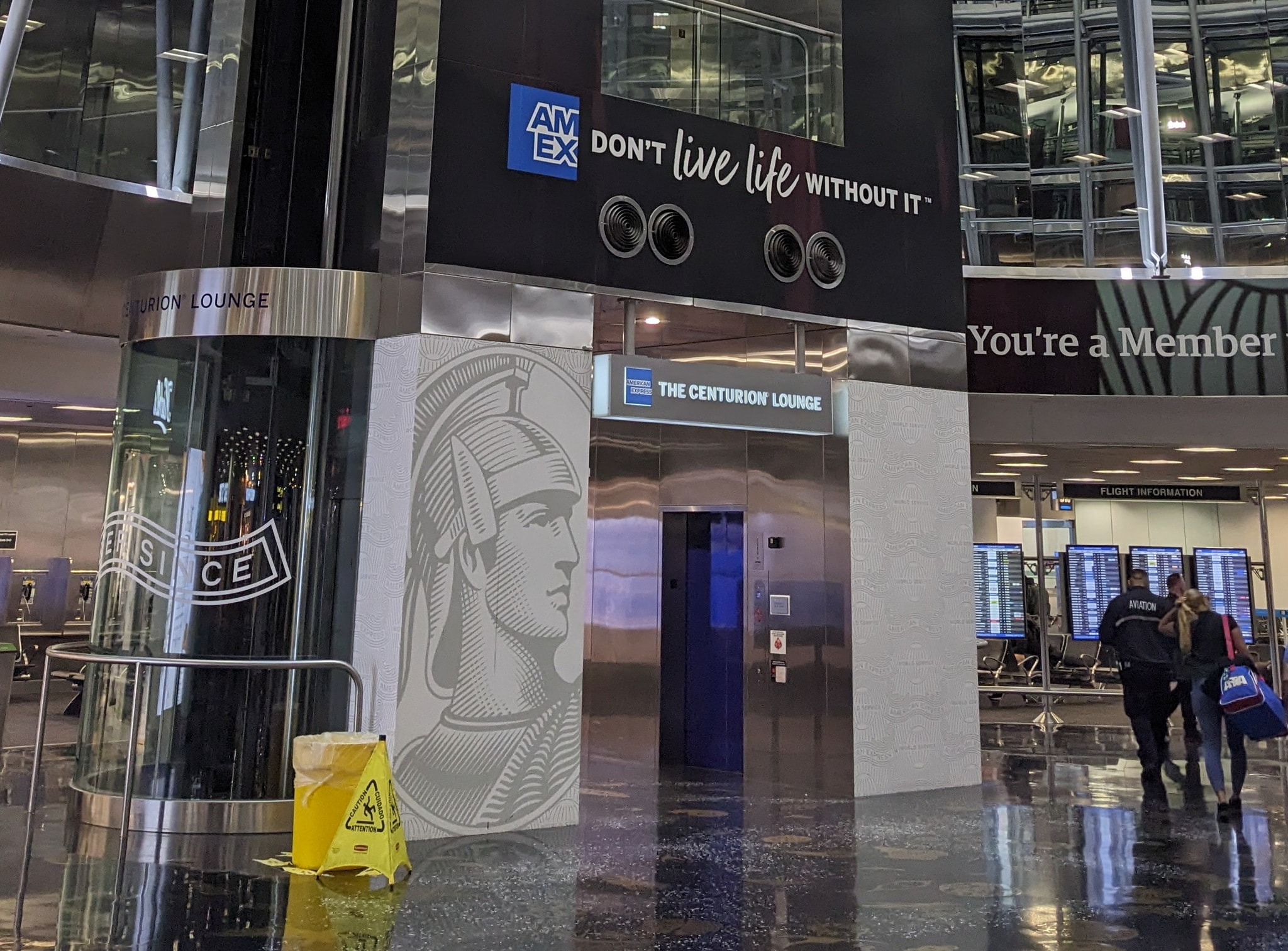 elevator and sign showing The Centurion Lounge.