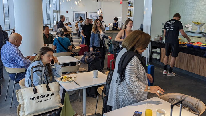 main dining area with tables and people eating.