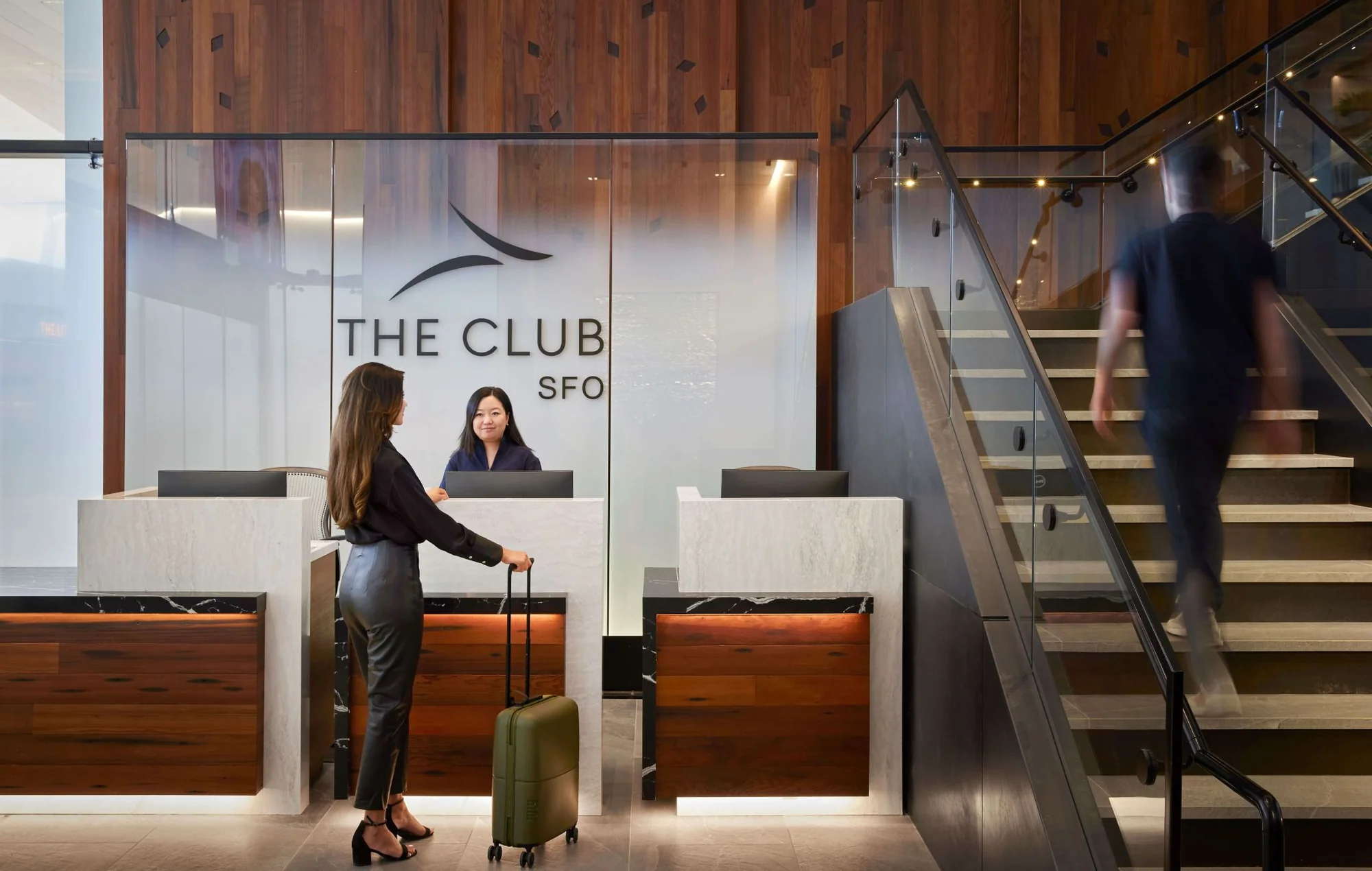 entrance desk for The Club at SFO with a person waiting for checkin.