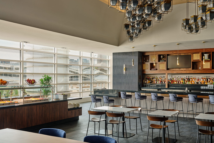 bar area with buffet and tables.