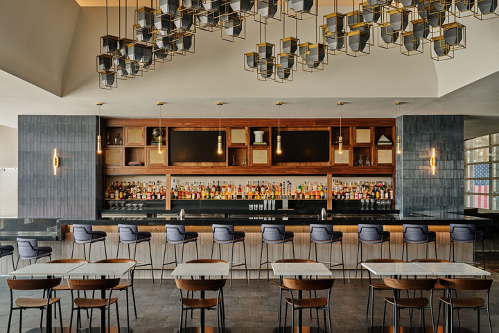 main bar area with seating and tables.