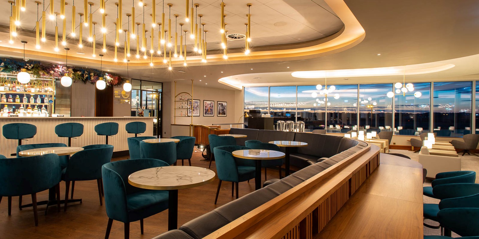 airport lounge in edinburgh with seating and warm lights