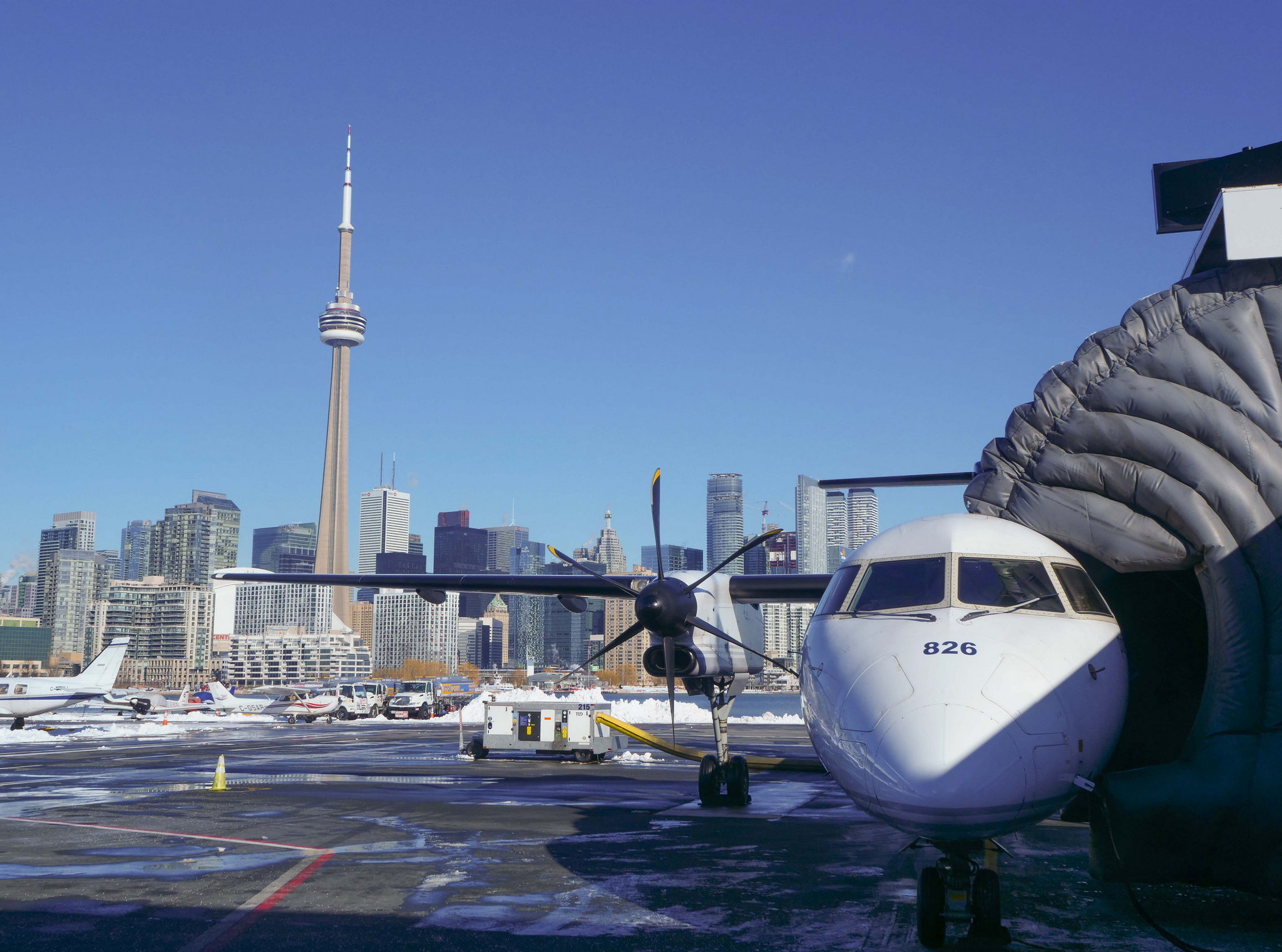 CN tower and airplane at Toronto City Airport