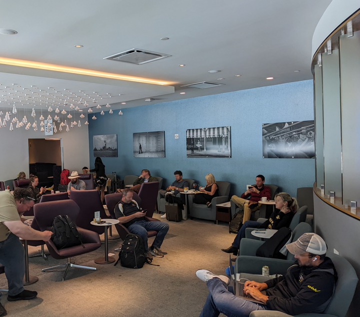 photo of the main lounge area with chairs and people.