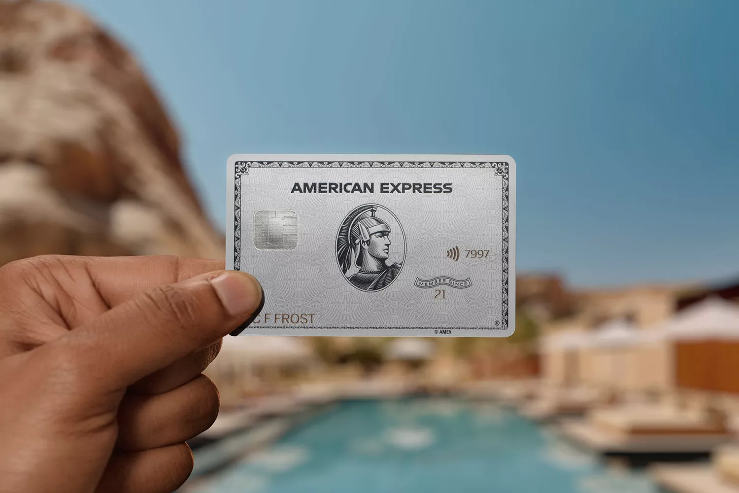 person holding up an American Express Platinum Card