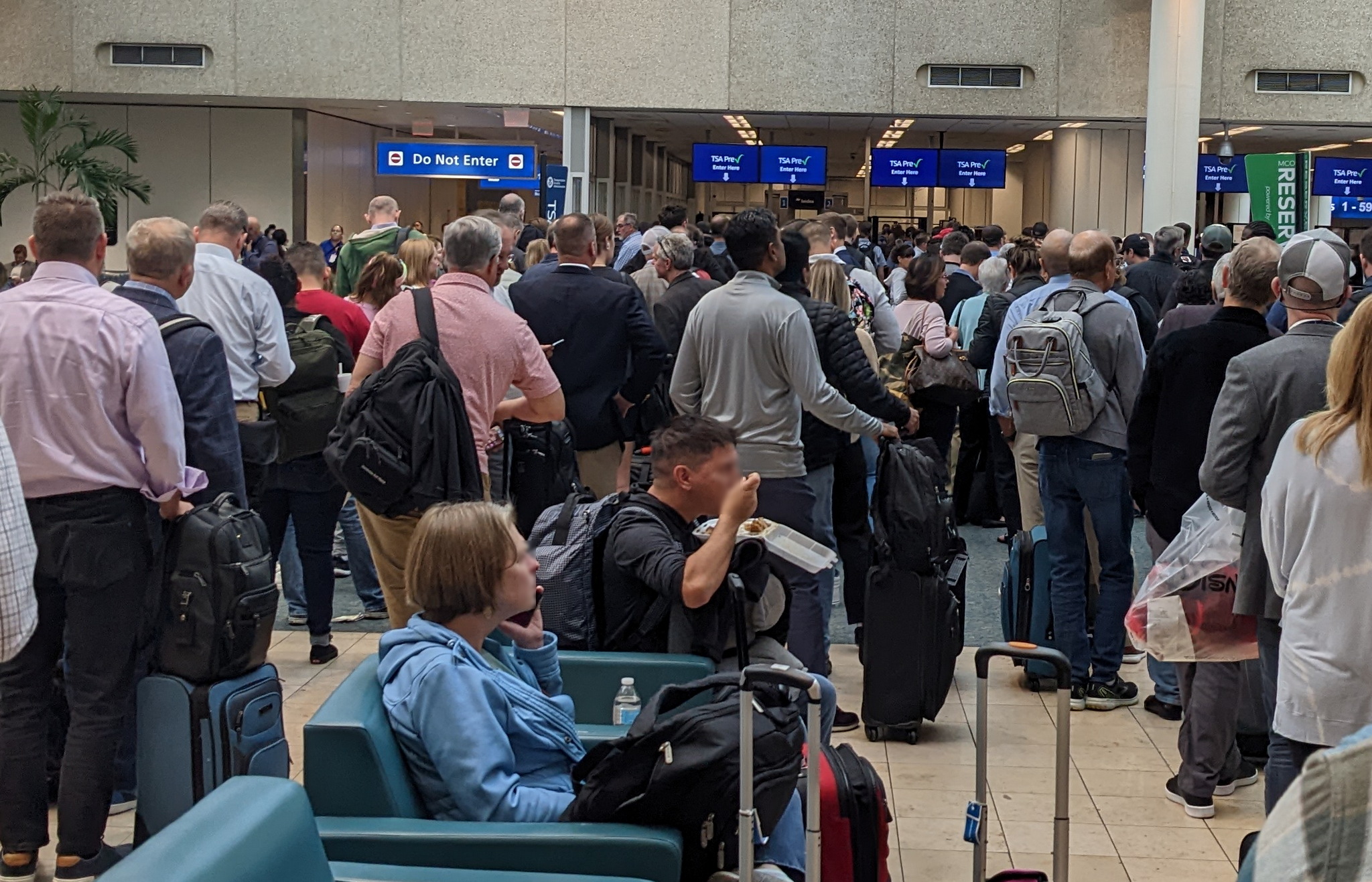 people waiting at TSA PreCheck line at MCO