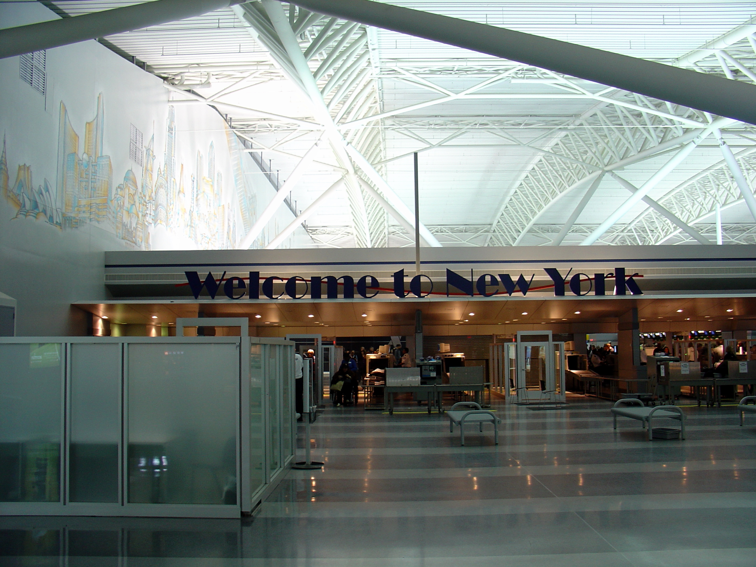 JFK terminal 9 - sign reading Welcome to New York