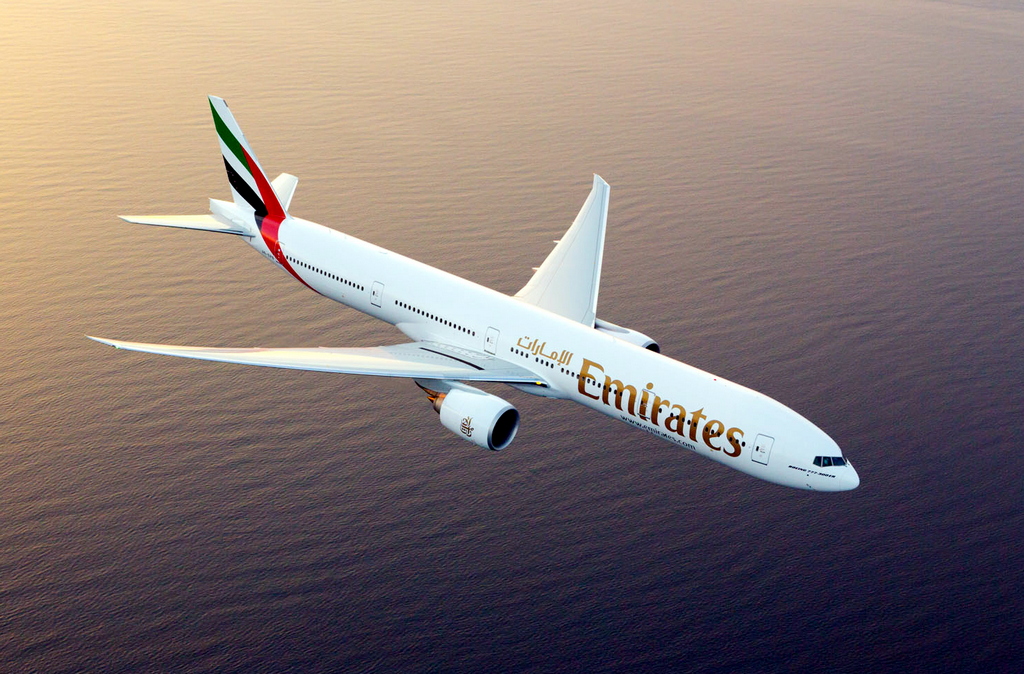 Emirates Boeing 777 flying over water
